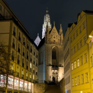 Night view up the steep stone steps (the Marienstiege) to the Gothic west front and openwork spire of Maria am Gestade...